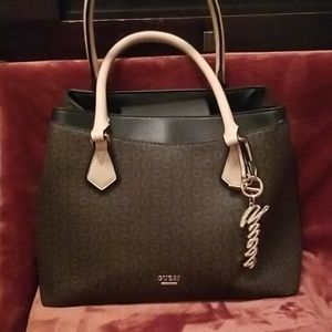 Like new two tone brown Guess purse with leather.
